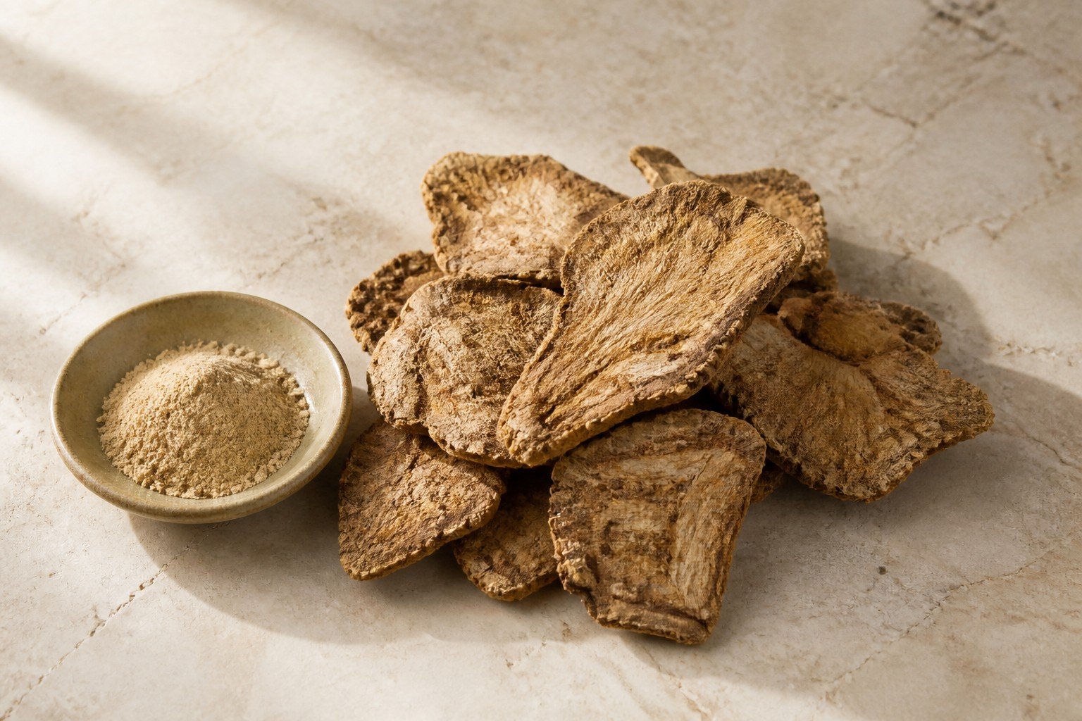 Dried botanical root slices with a matching extract-powder sample.